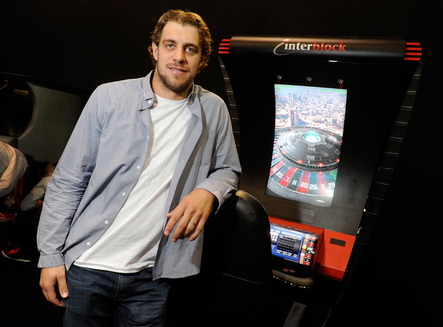 Hockey player Anze Kopitar of the Los Angeles Kings poses at the Interblock booth during G2E at the the Sands Expo and Convention Center on Wednesday. Kopitar is the spokesman for the Slovenian ga ...