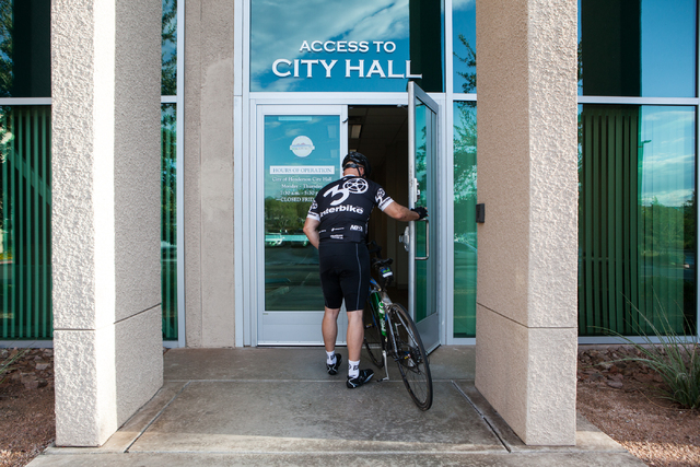 Henderson City Manager Jacob Snow walks into Henderson City Hall after commuting by bicycle on Monday, Sept. 9, 2013. (Chase Stevens/Las Vegas Review-Journal)