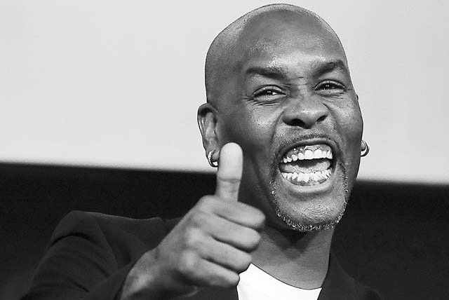 NBA All-Star Gary Payton, a member of the 2013 class of inductees into the Basketball Hall of Fame, gestures during a news conference at the Naismith Memorial Basketball Hall of Fame in Springfiel ...