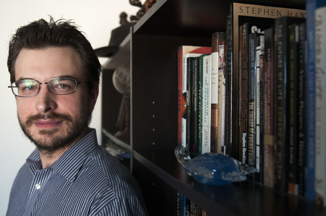 Osie Turner, a book fanatic who restores classic books into e-books, is photographed at his Sunrise home, Sept. 5. (Erik Verduzco/View)
