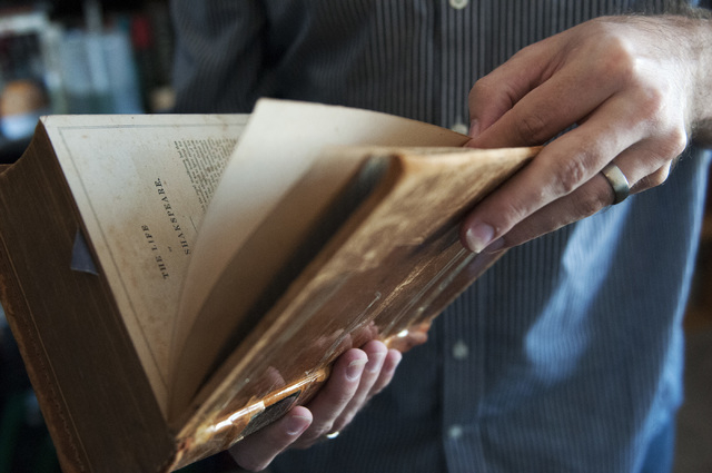 Osie Turner holds his 1800s copy of "Shakespeare's Works," Sept. 5. (Erik Verduzco/View)