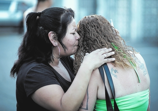 Rosie Lopez, left, embraces a woman during a Stop the Violence Rally in Las Vegas Friday, Sept. 13, 2013. (John Locher/Las Vegas Review-Journal)