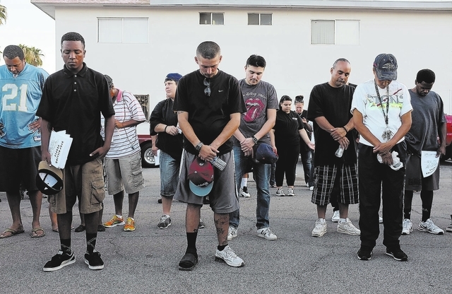 People pray during a Stop the Violence Rally in Las Vegas Friday, Sept. 13, 2013. (John Locher/Las Vegas Review-Journal)