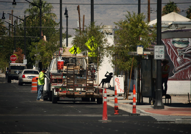 A person takes a drink amid construction along D Street in Las Vegas Wednesday, Sep. 4, 2013.  (Jessica Ebelhar/Las Vegas Review-Journal)