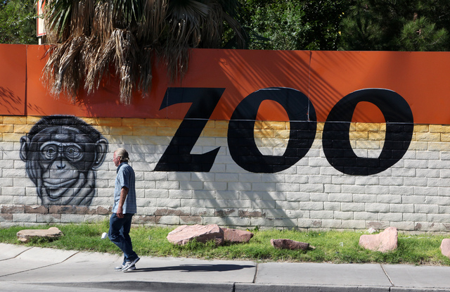 A man walks by the Southern Nevada Zoological Park on Rancho Drive. Officials have begun removing animals from the zoo. (Justin Yurkanin/Las Vegas Review-Journal)
