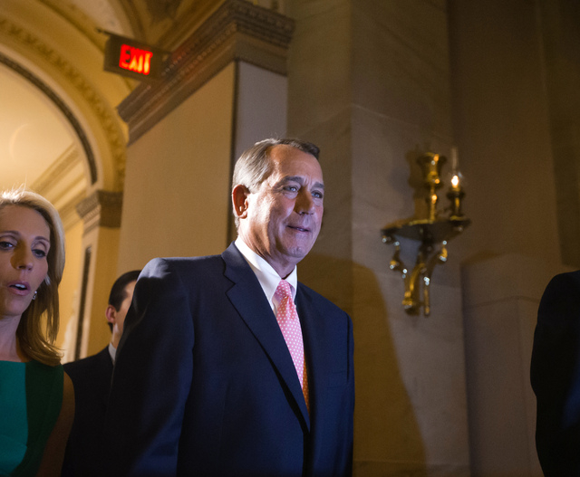 Speaker of the House John Boehner, R-Ohio, returns to his office after a procedural vote on the House floor Monday at the Capitol in Washington. (AP Photo/J. Scott Applewhite)