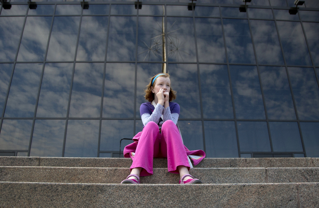Fay Wagstaff of El Paso, Texas. sits on the front steps of the closed Smithsonian National Air and Space Museum in Washington, Tuesday, Oct. 1, 2013. Congress plunged the nation into a partial gov ...