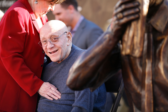 Jerry Tarkanian sits with his likeness and his wife Lois after the unveiling of his statue at UNLV's Thomas & Mack Center outdoor plaza on Wednesday Oct. 30, 2013. (Alex Federowicz/Las Vegas Revie ...