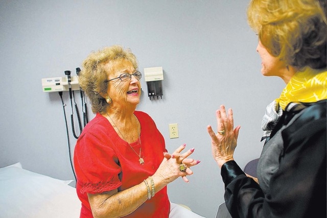 Mary Ann Hoban, 83, left, hears good news from her oncologist, Heather Allen, right, at Comprehensive Cancer Centers of Nevada on Friday, Sept. 20, 2013. Hoban began participating in a breast canc ...