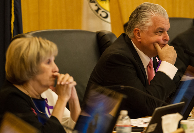 Clark County Commissioner Steve Sisolak, right, and Commissioner Susan Brager listen to public comment during a hearing raising the sales tax on Tuesday. (Chase Stevens/Las Vegas Review-Journal)