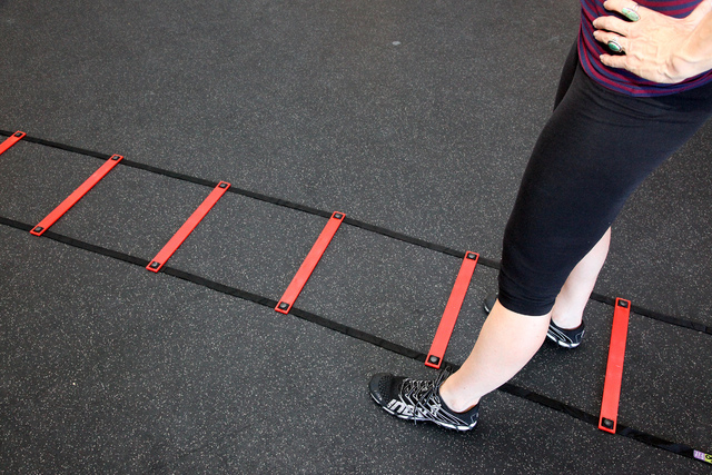Trainer Laura Salcedo demonstrates the middle position for the agility ladder exercise at CrossFit Mountains Edge in Las Vegas on Wednesday, Oct. 2, 2013. (Justin Yurkanin/Las Vegas Review-Journal)