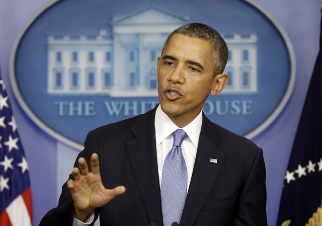 President Barack Obama, speaking Monday in the media briefing room of the White House, said a government shutdown would throw a wrench into the gears of U.S. economy. (AP Photo/Pablo Martinez Mons ...