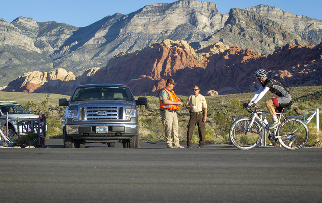 Bureau of Land Management officials man the entrance to the Red Rock Canyon National Conservation Area on Tuesday. The popular recreation area is closed because of the federal government budget im ...