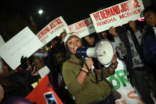 FILE - In this Nov. 7, 2013, file photo, Siwatu-Salama Ra, 22, of Detroit, speaks to the crowd during a rally to protest the shooting death of Renisha McBride at the Dearborn Heights, Mich., Justi ...