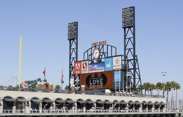 The scoreboard at AT&T Park displays a sign for Miles Scott, as Batkid, in San Francisco, Friday, Nov. 15, 2013. (AP Photo/Jeff Chiu)