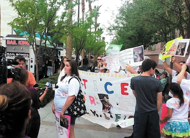 Sarah Hecht protests with others at the Regional Justice Center on Thursday in this photo posted on Facebook. She is standing in front of a banner that says Justice for Freckles.