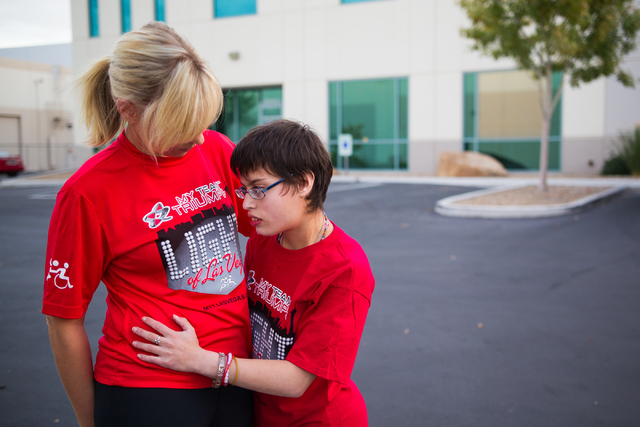 Taylor Little, 20, hugs her mother, Eden Capsouto, after a training run Thursday. Capsouto says, “Every Saturday and Sunday, (Taylor) says, ‘When are we going training?’ She gets up early an ...