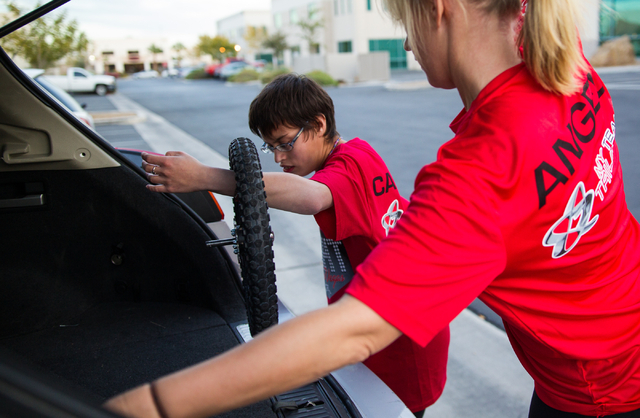 Eden Capsouto, right, and daughter Taylor Little, 20, put away parts of a jogging stroller after a run Thursday in preparation for Sunday’s Rock ‘n’ Roll Las Vegas Half-Marathon. Little was  ...