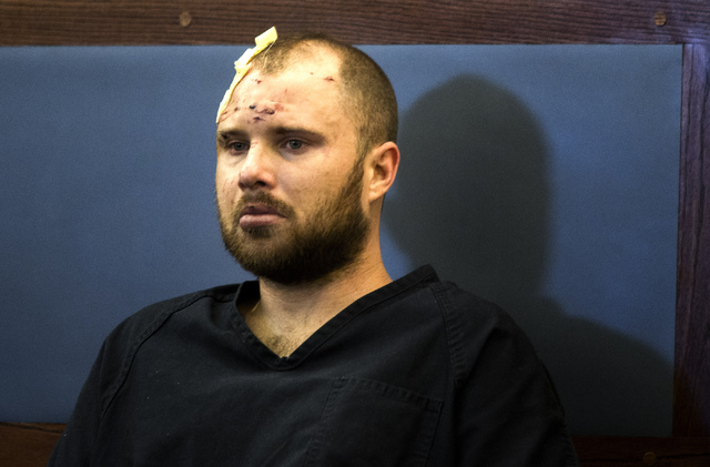 James Montgomery appears in Clark County Justice Court on Wednesday, Aug. 21. He is charged with death of a California highway patrolman and his brother-in-law in a Las Vegas carjacking. (Jeff Sch ...