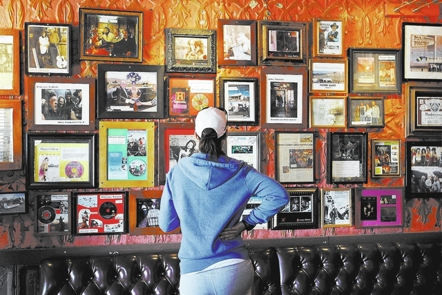 Cynthia Thomas examines some memorabilia during the 100th birthday celebration for the Pioneer Saloon in Goodsprings on Oct. 19, 2013. (Jason Bean/Las Vegas Review-Journal)