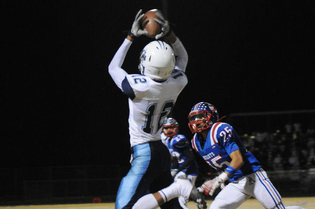 Canyon Springs wide receiver Jordan Davis (12) makes a catch against Liberty during the Sunrise Region semifinal game at Liberty High School in Henderson, Friday, Nov. 15, 2013. Canyon Springs was ...