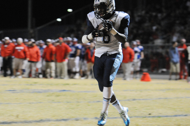Canyon Springs linebacker Marck Cassino (6) catches a ball for a touchdown against Liberty during the Sunrise Region semifinal game at Liberty High School in Henderson, Friday, Nov. 15, 2013. Cany ...
