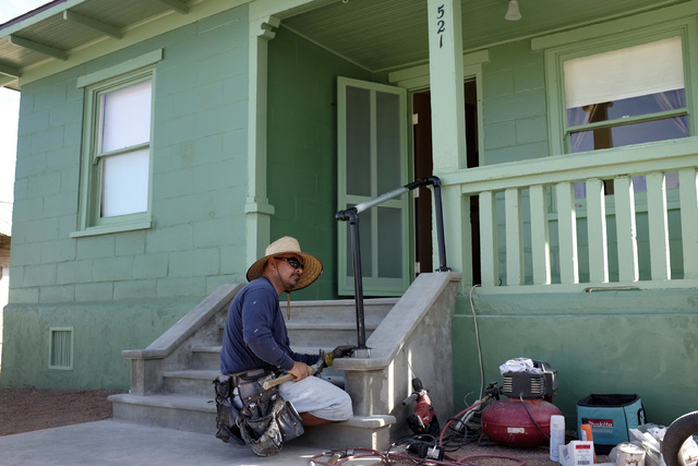 Joe Maturino installs a hand rail at  an old railroad cottage at the Clark County Museum in Henderson Thursday. The cottage was moved from Las Vegas to the museum and will be open to the public.   ...
