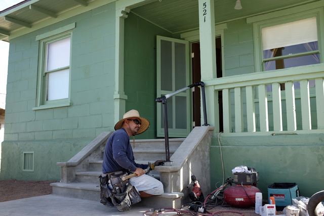 Joe Maturino installs a hand rail at an old railroad cottage at the Clark County Museum in Henderson Thursday. The cottage was moved from Las Vegas to the museum and will be open to the public. ...
