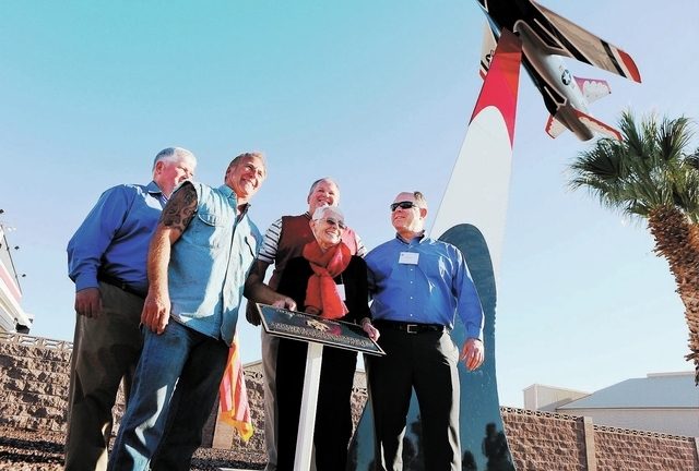 Shirley Buckley, center, stands with her sons Bill, far left, Mark, third from left, and Greg Devlin, far right, during a rededication ceremony for her late husband Capt. Gene Devlin outside the T ...