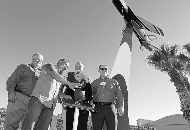 Shirley Buckley, center, stands with her sons Bill, far left, Mark, third from left, and Greg Devlin, far right, during a rededication ceremony for her late husband Capt. Gene Devlin outside the T ...