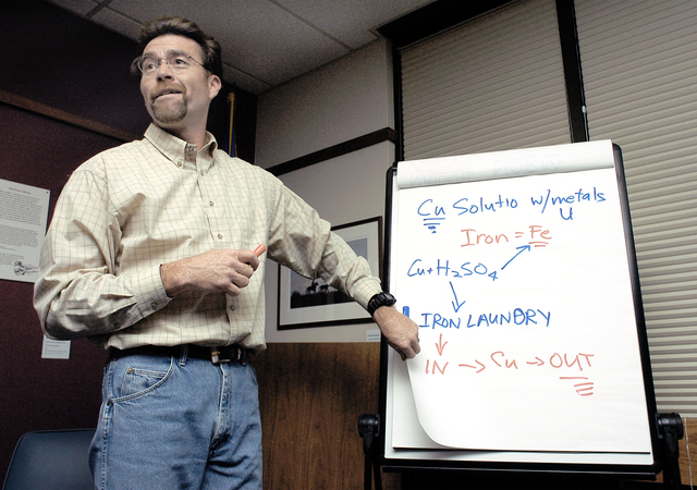 Earle Dixon explains the chemical processes used to extract copper at the former Anaconda mine in Yerington on Dec. 8, 2004. Dixon, who said he was fired by the Bureau of Land Management for refus ...