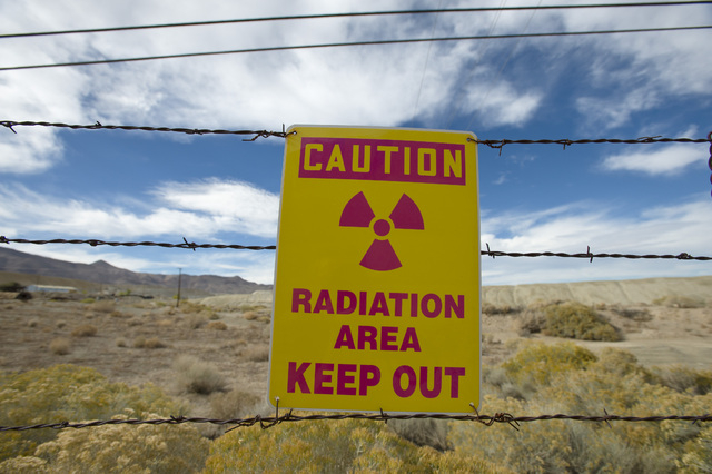 A sign gives a warning at the former Anaconda copper mine site near Yerington. After decades of state and mine officials claiming that radiation and arsenic contamination in the local wells occurr ...