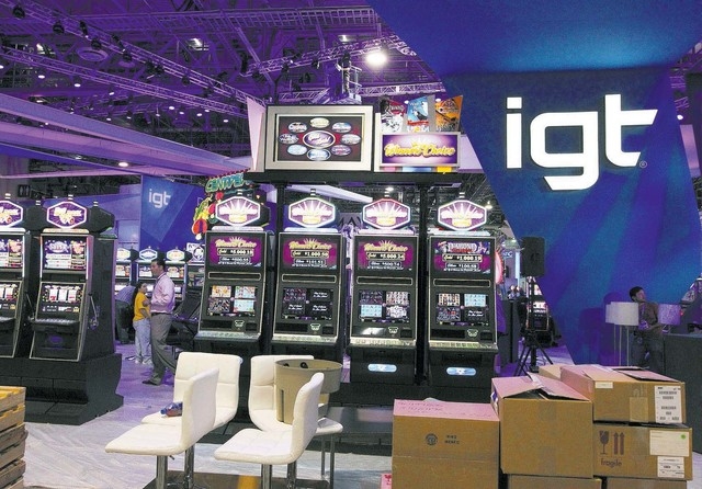 The new IGT logo is seen at the IGT booth at the G2E convention in the Sands Expo in Las Vegas, Monday, Sept. 23, 2013. G2E opens on Tuesday, Sept. 24, 2013. (File, JERRY HENKEL/LAS VEGAS REVIEW-J ...