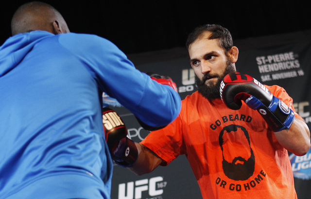 Johny Hendricks, right, works out for the media Wednesday ahead of his bout against welterweight champion Georges St. Pierre in the main event of UFC 167 on Saturday. (Jason Bean /Las Vegas Review ...