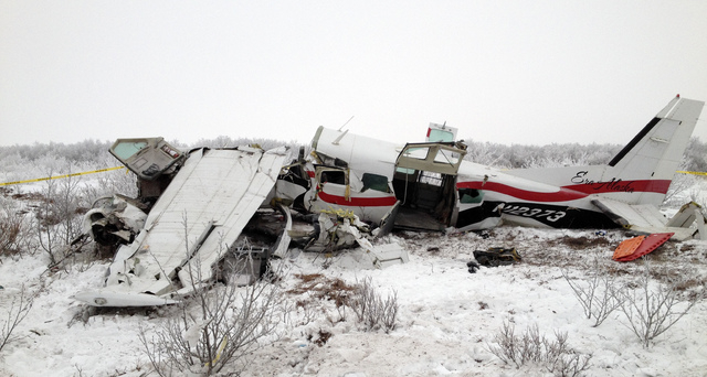 This image provided Saturday Nov. 30, 2013, courtesy of Alaska State Troopers shows the wreckage of a plane that crashed Friday near St. Marys, Alaska. Authorities said the pilot and three passeng ...