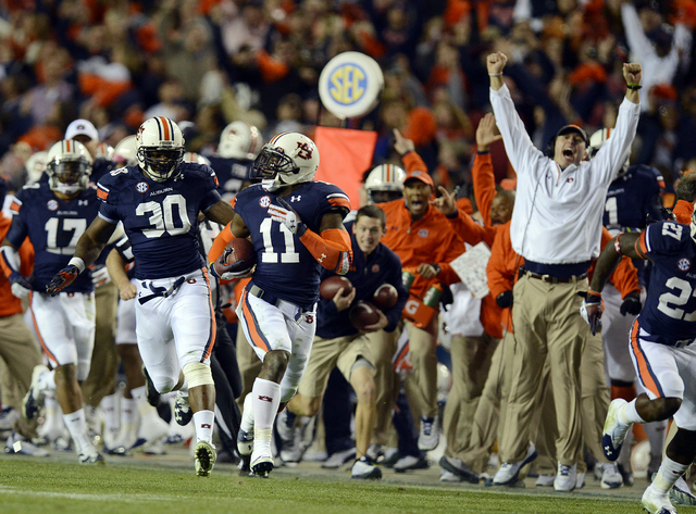 Auburn cornerback Chris Davis (11) returns a missed field-goal attempt more than 100 yards for a touchdown on the final play of an NCAA college football game against Alabama in Auburn, Ala., Satur ...
