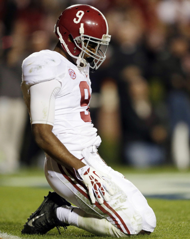 Alabama wide receiver Amari Cooper (9) reacts during their 34-28 loss to Auburn in an NCAA college football game in Auburn, Ala., Saturday, Nov. 30, 2013. (AP Photo/Jay Sailors)