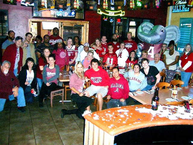 Alabama fans pose during a viewing party for the Crimson Tide’s game against Auburn on Saturday. Top-ranked Alabama lost to the rival Tigers on a missed field-goal return. (Courtesy)