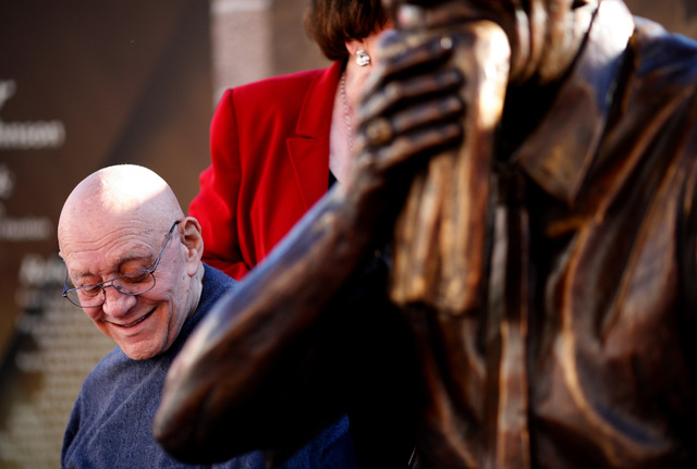 Jerry Tarkanian sits with his likeness after the unveiling of his statue at UNLV's Thomas & Mack Center outdoor plaza on Wednesday Oct. 30, 2013. (Alex Federowicz/Las Vegas Review-Journal)
