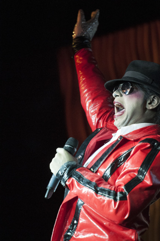 Sean E. Cooper entertains the crowd with his Michael Jackson impression during his show at Sin City Theatre inside Planet Hollywood hotel-casino in Las Vegas, Saturday, Dec. 7, 2013. (Erik Verduzc ...