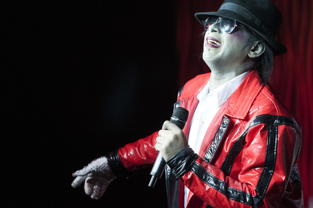 Sean E. Cooper entertains the crowd with his Michael Jackson impression during his show at Sin City Theatre inside Planet Hollywood hotel-casino in Las Vegas, Saturday, Dec. 7, 2013. (Erik Verduz ...