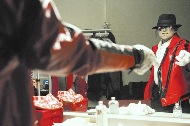 Sean E. Cooper gets ready before entertaining the crowd with his Michael Jackson impression during his show at Sin City Theatre inside Planet Hollywood hotel-casino in Las Vegas, Saturday, Dec. 7, ...