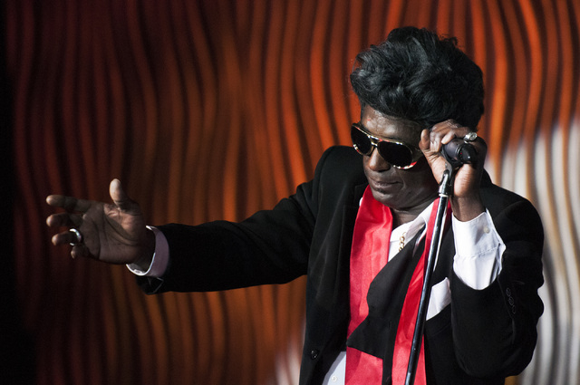 Sean E. Cooper performs an Elvis Presley impression during his show at Sin City Theatre inside Planet Hollywood hotel-casino in Las Vegas, Saturday, Dec. 7, 2013. (Erik Verduzco/Las Vegas Review-J ...