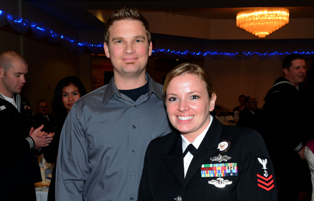 BANGOR, Wash. (Dec. 13, 2013) Navy Counselor 1st Class (SCW/FMF) Sara Dozer, right, with her husband Wes Dozier, left, at the Submarine Group 9 Sailor of the Year luncheon. (U.S. Navy photo by Chi ...