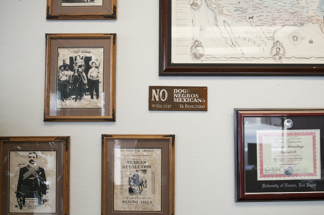 Historical images and signs are seen covering the office walls of Esperanza Motelongo, owner of Aztec Insurance in Las Vegas Saturday, Dec. 28, 2013. (Erik Verduzco/Las Vegas Review-Journal)