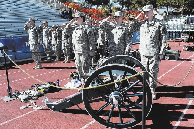 Members of the University of Nevada Reno's ROTC stand at attention while guarding the Fremont Cannon trophy before the start of the big rivalry football game between UNLV and UNR in Reno on Oct. 2 ...