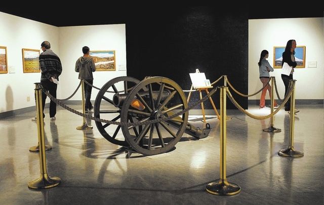 The Sturm family from Carson City explores the original Fremont Cannon exhibit at the Nevada State Museum in Carson City on Oct. 25, 2013. The photos on the walls show locations where John C. Frem ...
