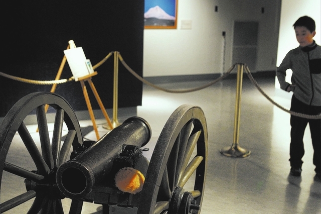 9-year-old William Liu, from Reno, checks out the original Fremont Cannon exhibit at the Nevada State Museum in Carson City on Oct. 25, 2013. (Jason Bean/Las Vegas Review-Journal)