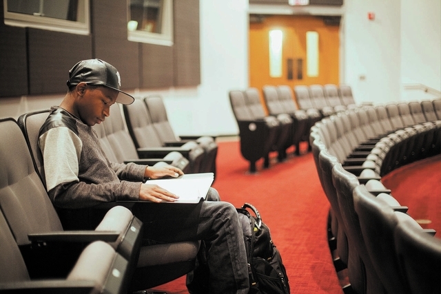 Fifteen-year-old UNLV student Ke'Andre Blackston Jr. goes over notes before he performs in his Musical Theater class at the Paul Harris Theatre on the UNLV campus in Las Vegas Wednesday, Nov. 27,  ...