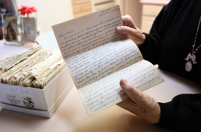 Fern Jennings, 83, holds a hand-written letter from her husband dated December 19, 1944, while sitting in her kitchen Wednesday, Dec. 11, 2013, in Las Vegas. Jennings came across the hand-written  ...